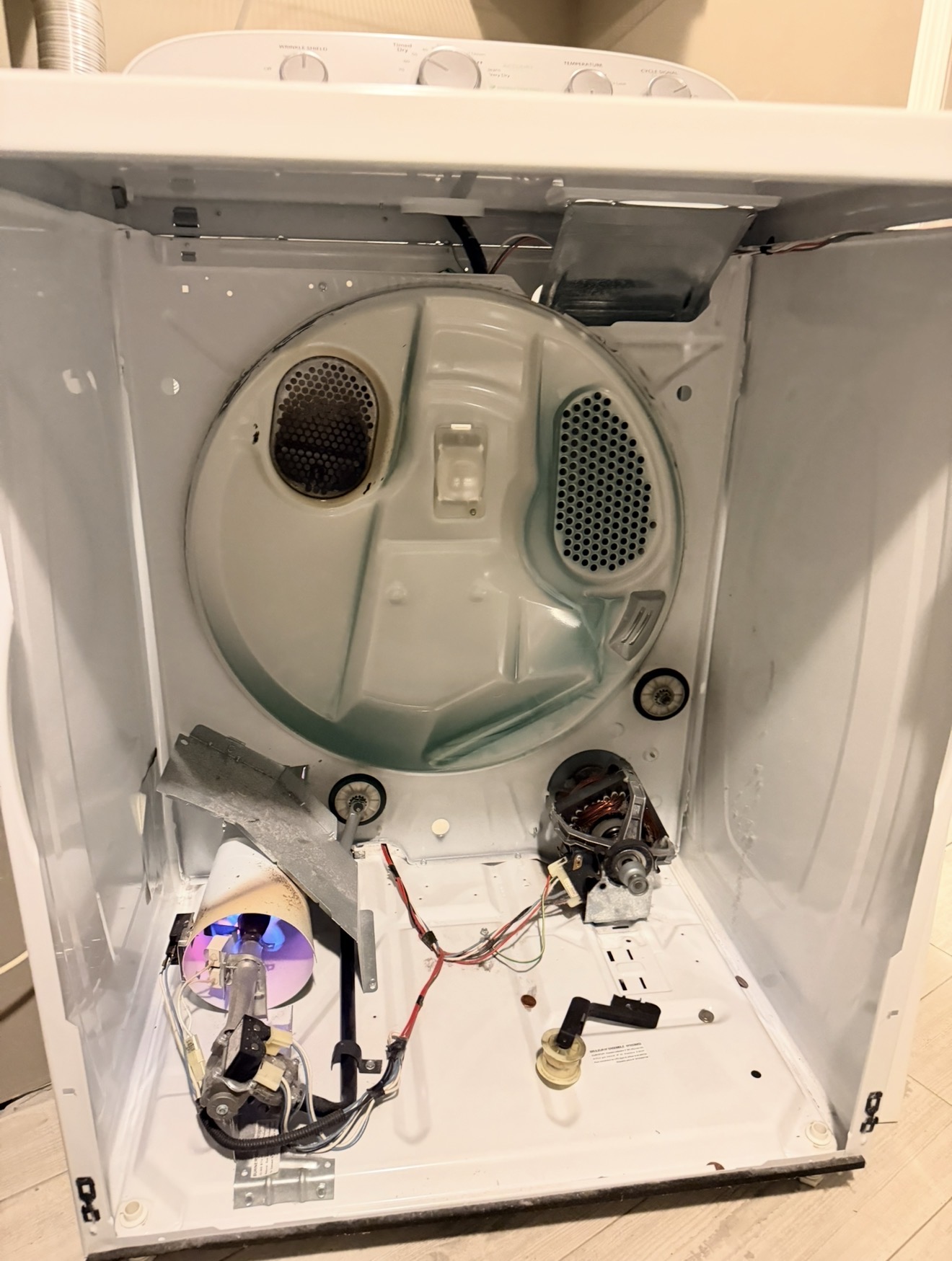 LG dryer heating element diagnosis — burner assembly disassembled during repair in Great Kills Staten Island