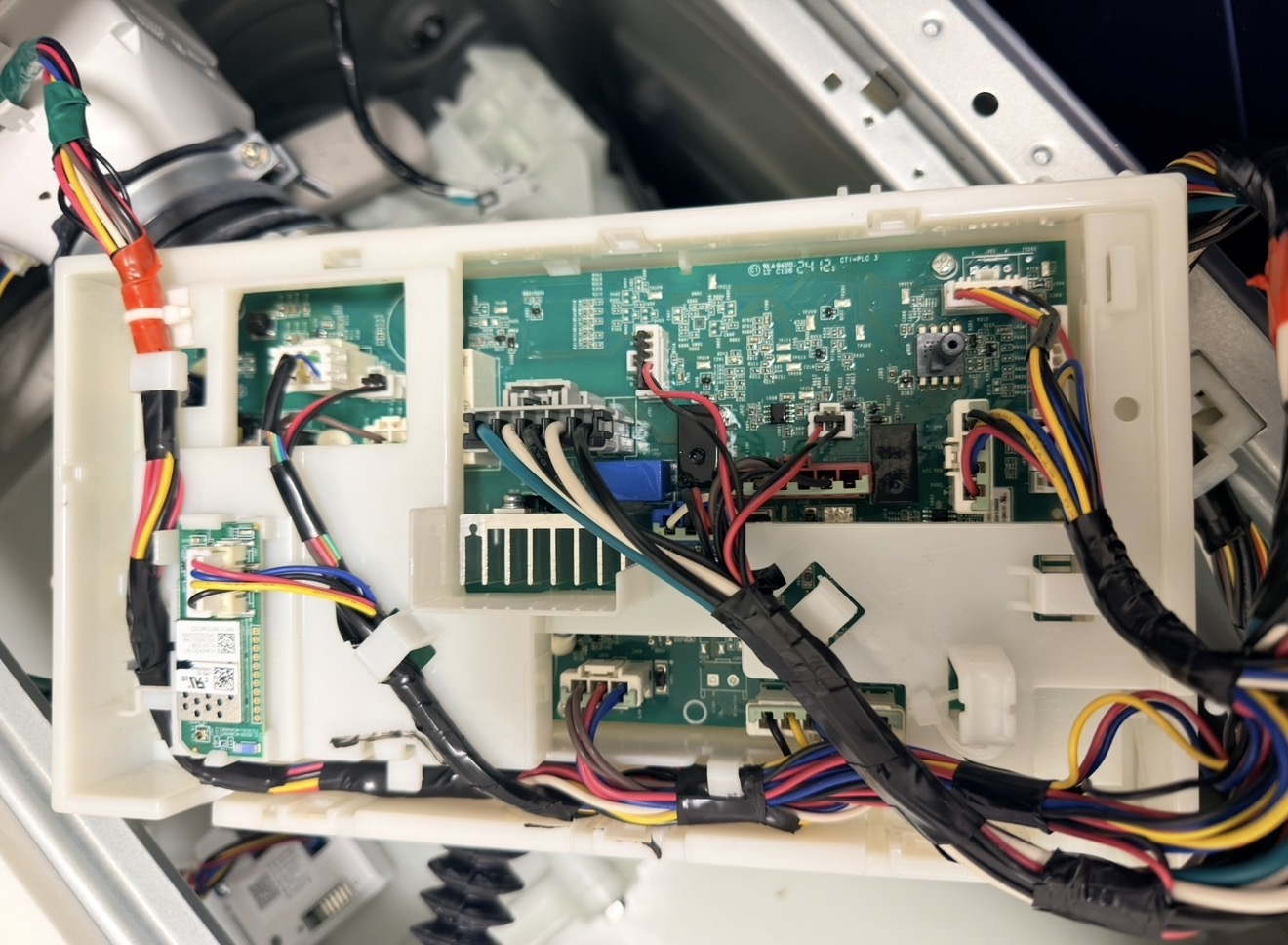 GE washer control board and PCB exposed with wiring harness — control board diagnosis and replacement by Premier Appliance Repair Staten Island